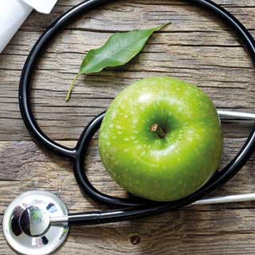 Schlagzeilen - grüner Apfel und Stethoskop